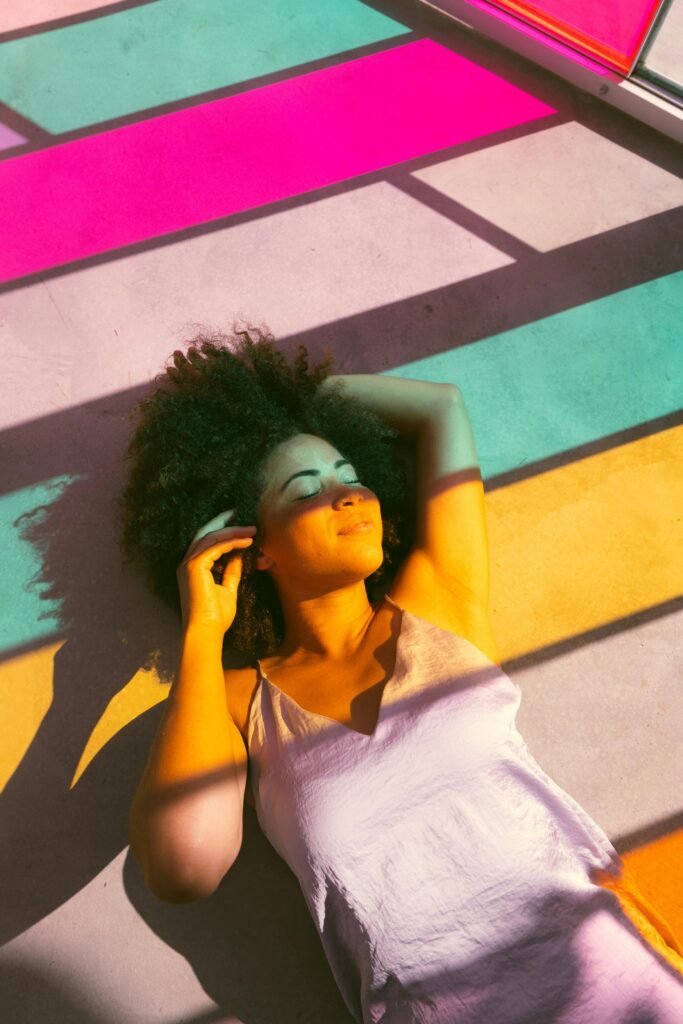 Women Lying Near to a Multicolored Glass Window